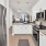 a kitchen with white cabinets