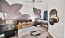 a bedroom with a bed and a fan