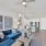 a living room with a blue couch
