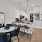 a dining room with a table and chairs