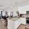 a kitchen with white cabinets