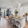 a kitchen with a dining table and chairs