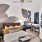 a bedroom with a bed and a fan
