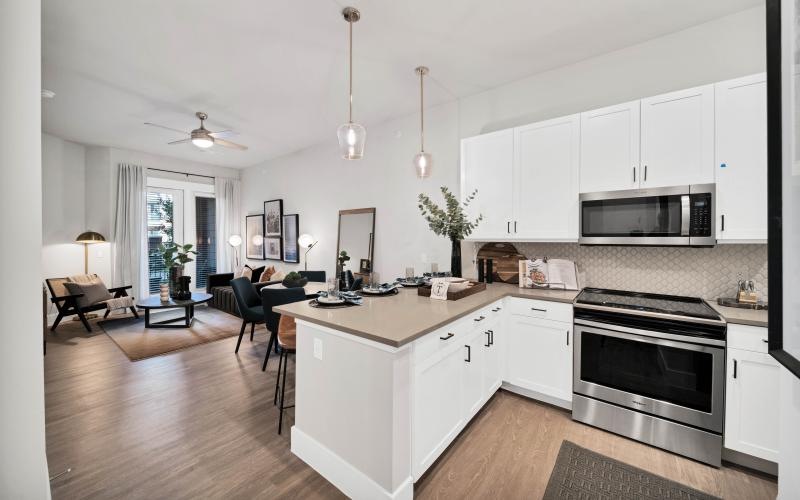a kitchen with white cabinets