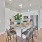 a kitchen with a dining table and chairs