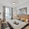a bedroom with a bed and a chair